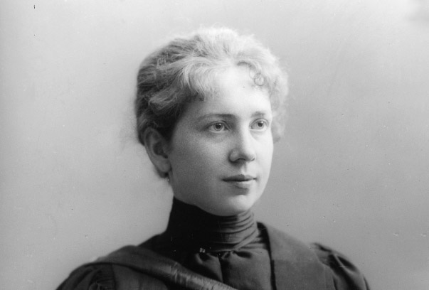 Historical black and white portrait of Harriet Brooks, wearing a high-collared dark dress and looking to the side.